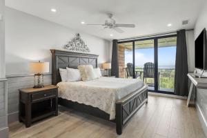a bedroom with a bed and a view of the ocean at 2371 Shipwatch Villa by Akers Ellis Rentals in Kiawah Island