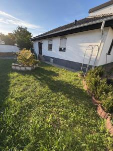 a yard of a house with a building at Villa Heusenstamm in Heusenstamm
