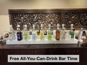 a display of bottles of alcohol on a counter at Hotel Balian Resort Chiba - Family Kids Group Concept in Chiba