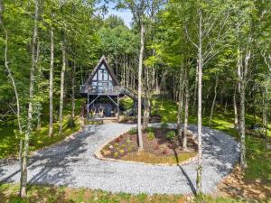 an overhead view of a house in the woods at Ascent A-Frame at Calm Ridge Treehouses in Boone