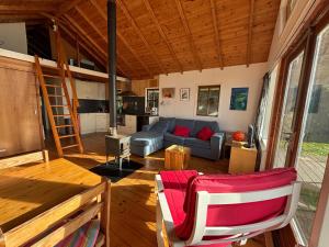 a large living room with a couch and a kitchen at De Smidse in Haren