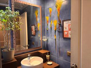 a bathroom with a sink and a mirror at Hostal Boutique 180 Grados in Algarrobo +29 photos