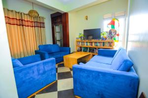 TV a/nebo společenská místnost v ubytování Hotel Acacia View