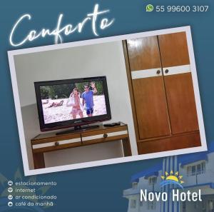 a picture of a tv in a living room at Novo Hotel in Caçapava do Sul