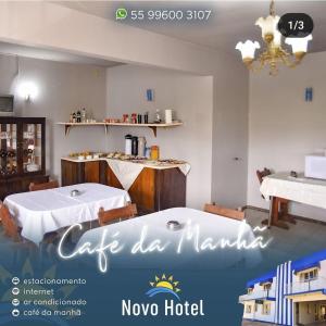 a restaurant with two tables in a room at Novo Hotel in Caçapava do Sul