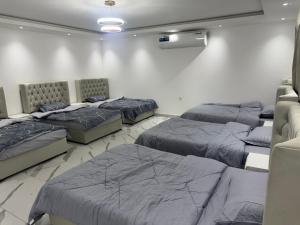 a room with four beds in a room at استرحه ام الحمام in Suḩaybah +27 photos