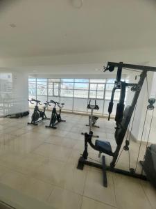 a gym with several tread machines in a room at Moderno apartamento con vista al mar en Cartagena in Cartagena de Indias