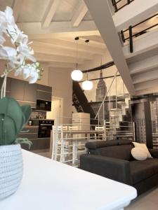 a living room with a couch and a table at A casa di Marzia - 2 in Oleggio