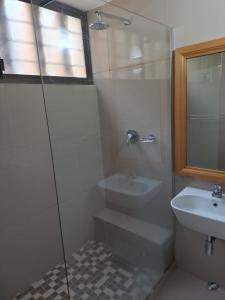 a bathroom with a shower and a sink at Gugu's Holiday Home in Durban +7 photos