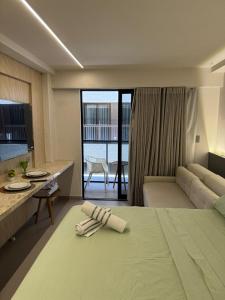 Ένα ή περισσότερα κρεβάτια σε δωμάτιο στο Beach haus conforto a beira mar