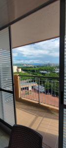 a balcony with a view of a parking lot at Departamento Completo Hacienda Peñalisa - Ricaurte in Ricaurte