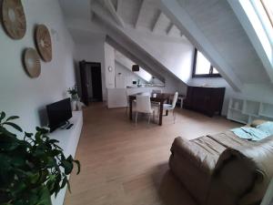 a living room with a couch and a table at La Fenice in Mortara