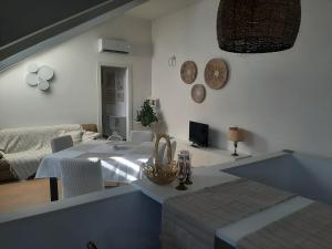 a living room with a table and a couch at La Fenice in Mortara