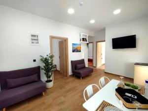 a living room with a couch and a table at Leonidio Downtown Haven in Leonidio