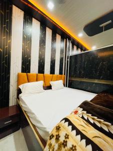 a bedroom with a large bed in a room at My Perfect Stay in Ayodhya