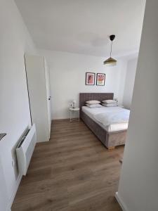 Postel nebo postele na pokoji v ubytování Apartman Divna