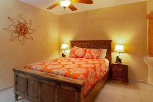 a bedroom with a bed and two lamps in it at Sonoran Spa W608 in Campo del Medio