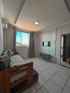 Телевизор и/или развлекательный центр в Varandas ao Mar apartamento 216 Praia Grande +26 фотографий