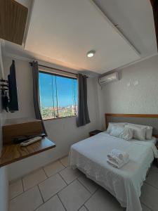 Кровать или кровати в номере Varandas ao Mar apartamento 216 Praia Grande