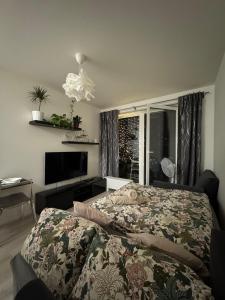 Ένα ή περισσότερα κρεβάτια σε δωμάτιο στο Apartment with garden-D&A