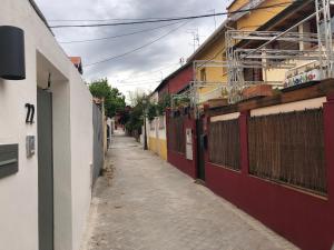 a narrow alley with buildings on either side at Spacious Chillout in Madrid in Madrid