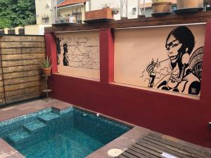 a swimming pool in a house with art on the walls at Spacious Chillout in Madrid in Madrid