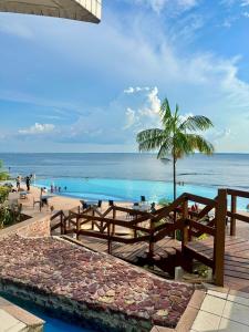 a view of the beach from a resort with a swimming pool at Hotel tropical Manaus suite luxo in Manaus