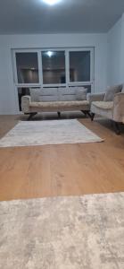 a living room with a couch and a table at Blert's apartment in Gjakova in Gjakove