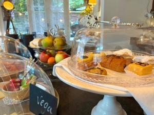 a display case filled with different types of food at Hotel Molendal in Arnhem