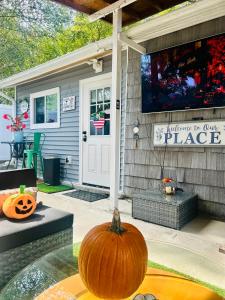 a pumpkin sitting on a table in front of a house at Fancy Studio Private Entrance in Selden +24 photos