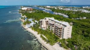 an aerial view of a building on the beach at 3BR Beachfront Elegant Condo -Family Getaway in Isla Mujeres