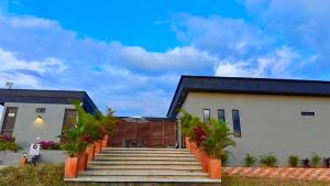 a house with a staircase in front of it at LUZ DE LUNA mesa de los santos house in Los Santos