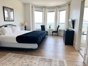 Ένα ή περισσότερα κρεβάτια σε δωμάτιο στο Seaview Executive Home +12 φωτογραφίες