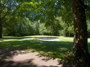 a tree in the middle of a golf course at Panoramic Retreat in Andkaer Vig - By Traum Ferienwohnungen in Børkop