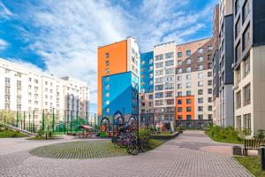 a group of buildings with bikes parked in a courtyard at ALMA PARK Apartments 326 in Taldykolʼ
