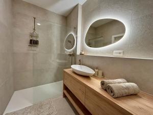 a bathroom with a sink and a mirror at Bluewave boho apartment Slnava in Banka