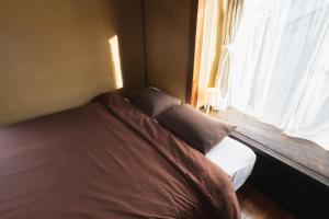 Ένα ή περισσότερα κρεβάτια σε δωμάτιο στο 一棟貸し宿 Guest House Mado +17 φωτογραφίες