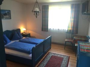 a small bedroom with a bed and a window at Haus Kernstock in Salzburg