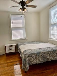 a bedroom with a bed and a ceiling fan at Downtown Updated Craftsman, Pet Friendly in Sonora