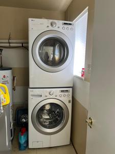 a washer and dryer in a small room at Edgewood Road in North Vancouver