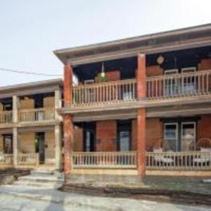 a large brick building with balconies on the side of it at Prime Location Top Rated Clean Parking Free! in Columbus