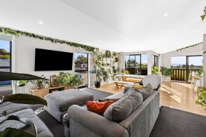a living room with a couch and a tv at Great Taste on Courtney in Motueka