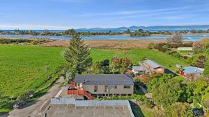 an aerial view of a farm with a house at Great Taste on Courtney in Motueka