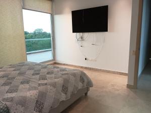 Giường trong phòng chung tại Resort frente al mar +70 ảnh