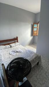 Ένα ή περισσότερα κρεβάτια σε δωμάτιο στο Pousada em Ilhéus