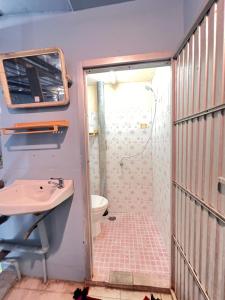 a bathroom with a shower and a sink at J Mansion in Ao Nang Beach +55 photos