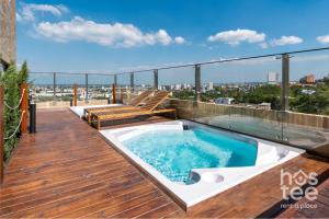 a hot tub on the roof of a building at H103 I Spacious Luxury Duplex I Central in Cali