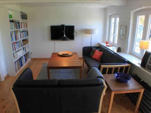 a living room with a couch and a table at 5 star holiday home in Søby Ærø in Soby Mark