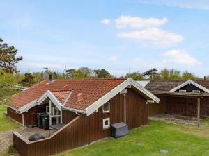 a house with a fence in front of it at 5 star holiday home in Store Fuglede in Ornum