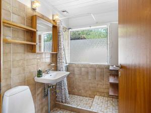 a bathroom with a sink and a window at 5 star holiday home in Hundested in Kulhuse +14 photos